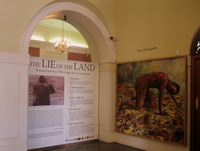 Installation view of exhibition entrance, with Penny Siopis's 'Terra Incognita' (1991)