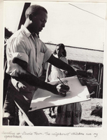 Peter Clarke sketching with an audience of interested children at Waterfall Flats in the 1960s