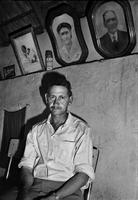 Man at home with can of Doom insecticide, Clanwilliam, South Africa