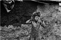 Carrying mud to plaster newly built home