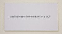 Steel helmet with the remains of a skull
