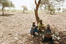 Three men rest at the side of the track between Bute Asbestos Mine and Heuningvlei in Northern Cape. 18 December 2002